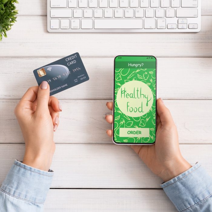 female-hand-holding-phone-with-app-delivery-food-on-screen.jpg